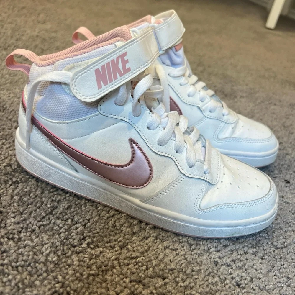 Pink and white Nike mid rises